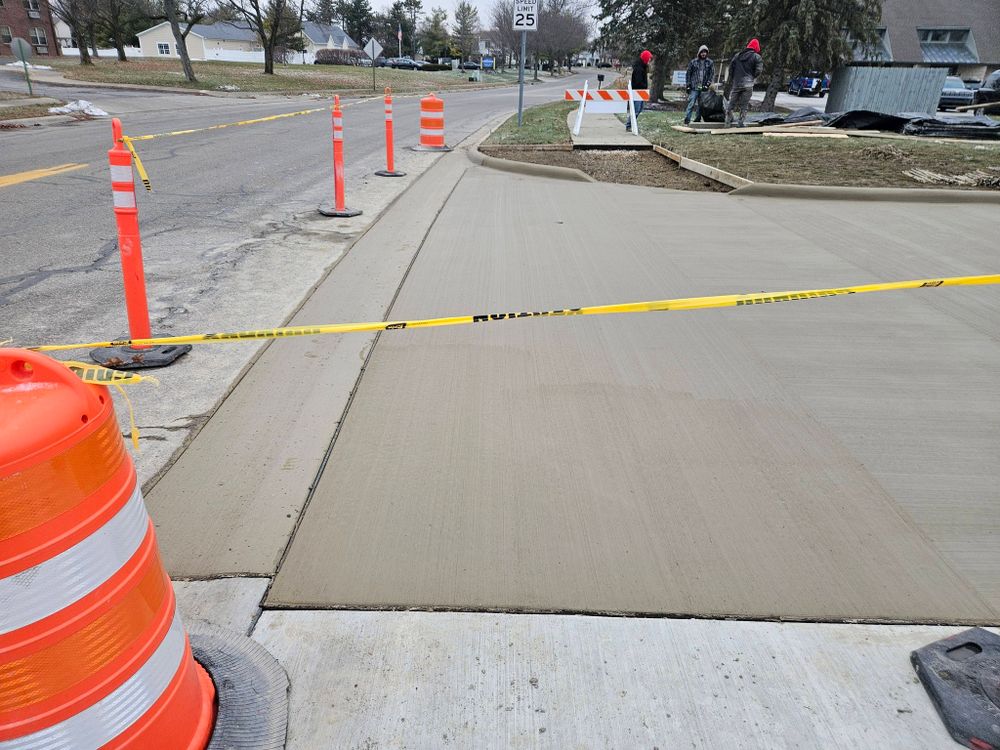 Our driveway construction service offers expert concrete slab construction, ensuring durable and aesthetically pleasing driveways tailored to enhance your home's curb appeal with precision and lasting quality. for Upright Concrete Construction LLC in Plain City, OH