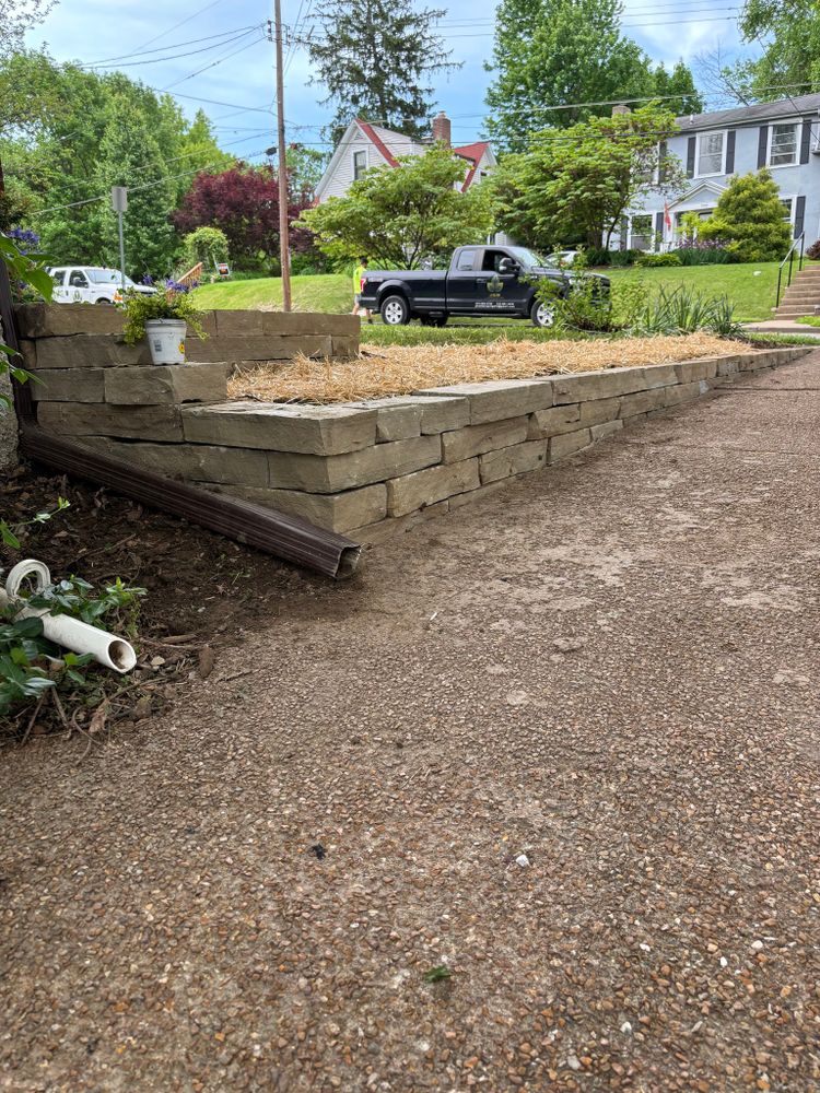 Our Retaining Wall Construction service provides expert design and installation of durable retaining walls to enhance the beauty and functionality of your landscape, ensuring stability for years to come. for J & B Landscaping in St. Louis, MO