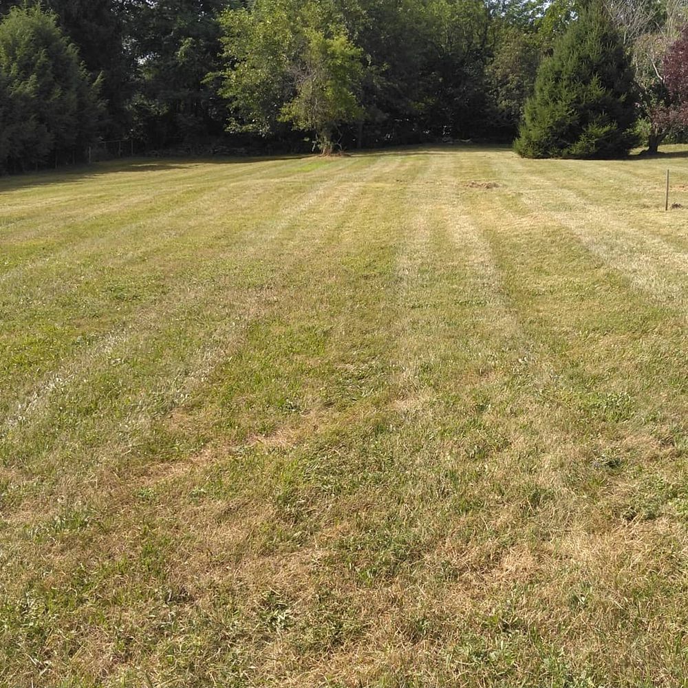 Our Mowing service ensures pristine lawns with precise trims, enhancing curb appeal and garden health while saving you time and effort, all handled by our skilled professionals using top-tier equipment. for Scott's Lawn Care and Landscaping LLC in Modena, NY