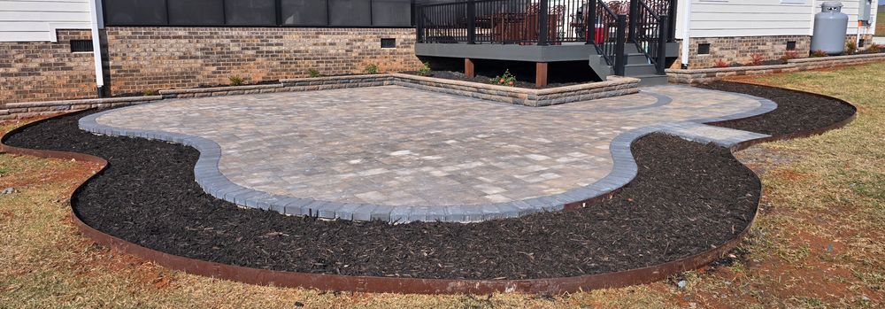 Enhance your outdoor living space with our expert Patio Design & Installation service, blending functionality and style, to create a stunning concrete patio tailored perfectly for relaxing or entertaining in your home. for JD Hardscapes & Landscaping LLC in Shelby, NC