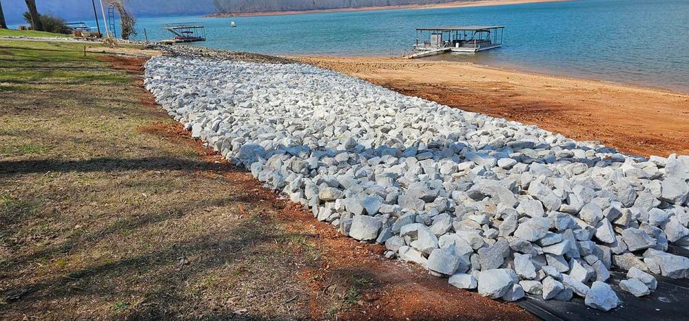 Our experienced team designs and installs durable rip rap to protect your shoreline from erosion, enhancing the stability and aesthetic appeal of your property for long-term peace of mind. for Restoration Shoreline Norris Lake Rip Rap in Norris Lake, TN