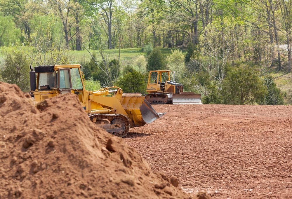 Our Land Grading service ensures a smooth, level surface for your property, improving drainage and foundation stability. Trust our skilled team to prepare your land for landscaping or construction projects with precision. for REJ Hauling in Jemison, AL