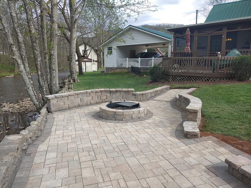 Enhance your outdoor living space with our expert fireplace installation services, seamlessly integrated into your landscaping design. Pair with our mulch installation for a cohesive, beautiful yard transformation. for Grayt Scapes LLC in Johnson City, TN