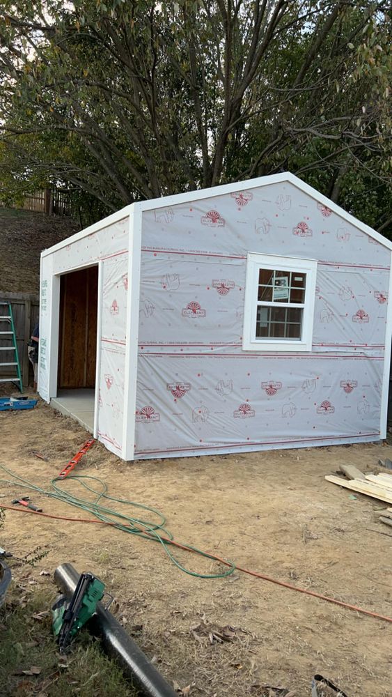 Our Shed Construction service offers customized, durable solutions, expertly designed and built to enhance your property with quality craftsmanship. Trust our team for efficient planning and seamless integration into your landscape. for Rock Solid Construction & Excavation in Munford, TN