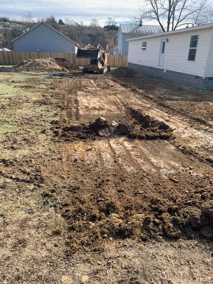 Our Leveling service ensures your land is precisely graded for construction, promoting stability and preventing drainage issues. Trust our experts to create a solid foundation for your next home project. for Sprouse’s Hauling and Excavating in Craigsville, VA