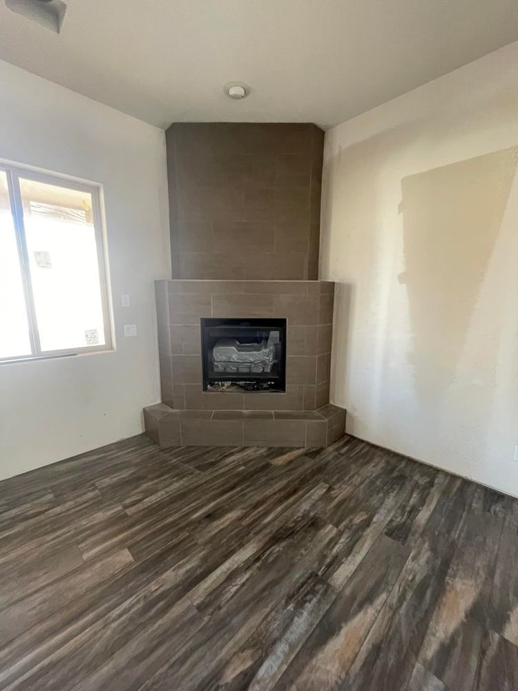 Enhance your home's warmth and elegance with our expert fireplace tiling services. Our skilled team ensures precise installation, transforming your fireplace into a stunning focal point of style and comfort. for C&N Flooring Solutions LLC in Chino Valley, AZ