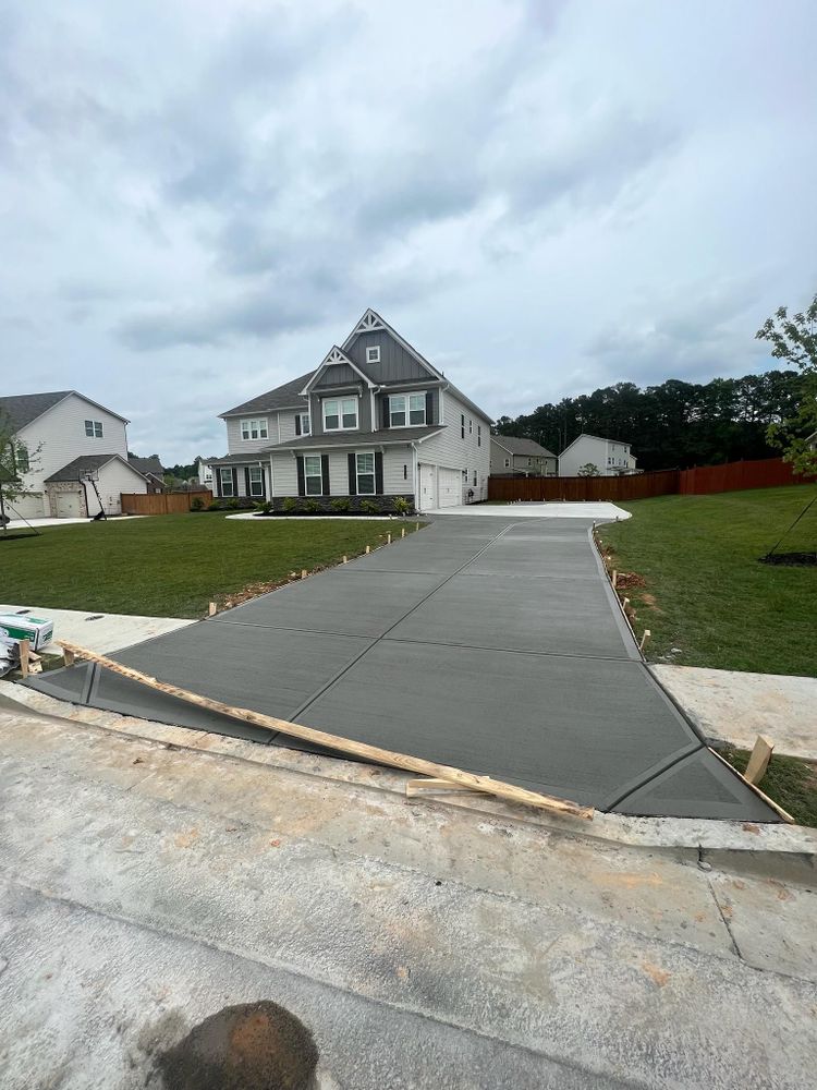 Transform your home's outdoor space with our expert driveway and patio remodel service. We craft durable, stylish concrete designs tailored to enhance curb appeal and maximize functionality for everyday living. for CANALES CONSTRUCTION in Marietta, GA