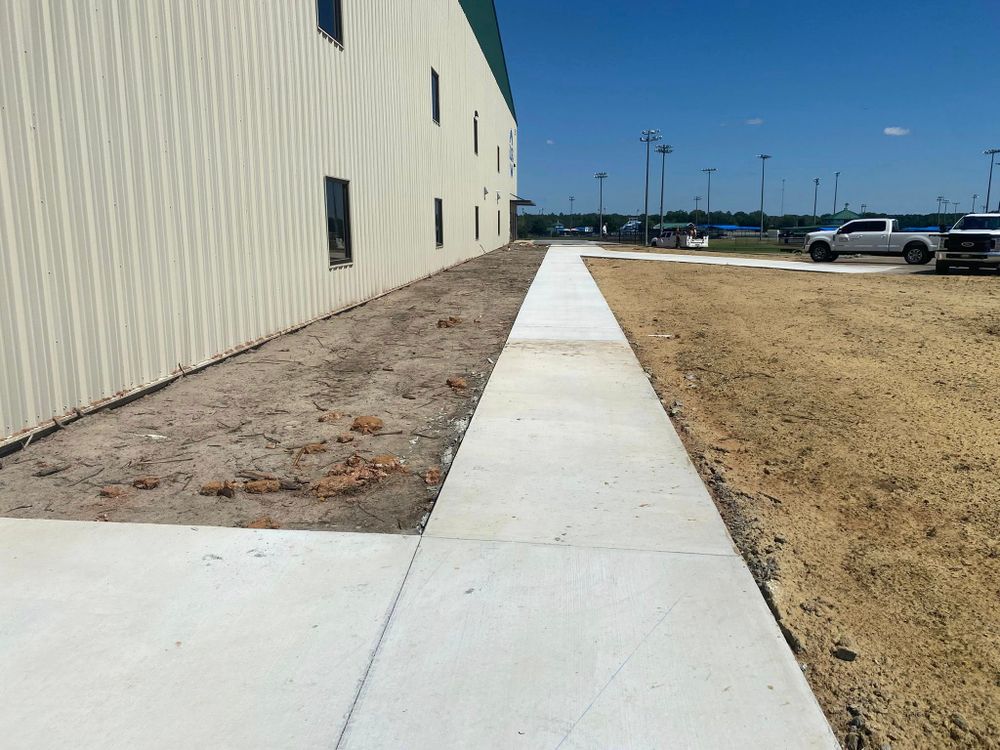 Enhance your home's curb appeal and ensure safe walkways with our professional Sidewalk Installation service. We deliver durable, high-quality concrete paths tailored to complement your landscaping needs. for Quality Flatwork & Concrete Construction in Dublin, GA