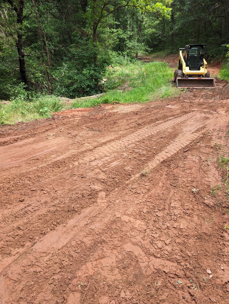 Our Land Grading service ensures a smooth, even terrain for optimal drainage and aesthetic appeal, enhancing your property's foundation stability for construction and landscaping projects. Trust our expertise to perfect your ground. for Nathan Foyil Bobcat Work in Guthrie, OK