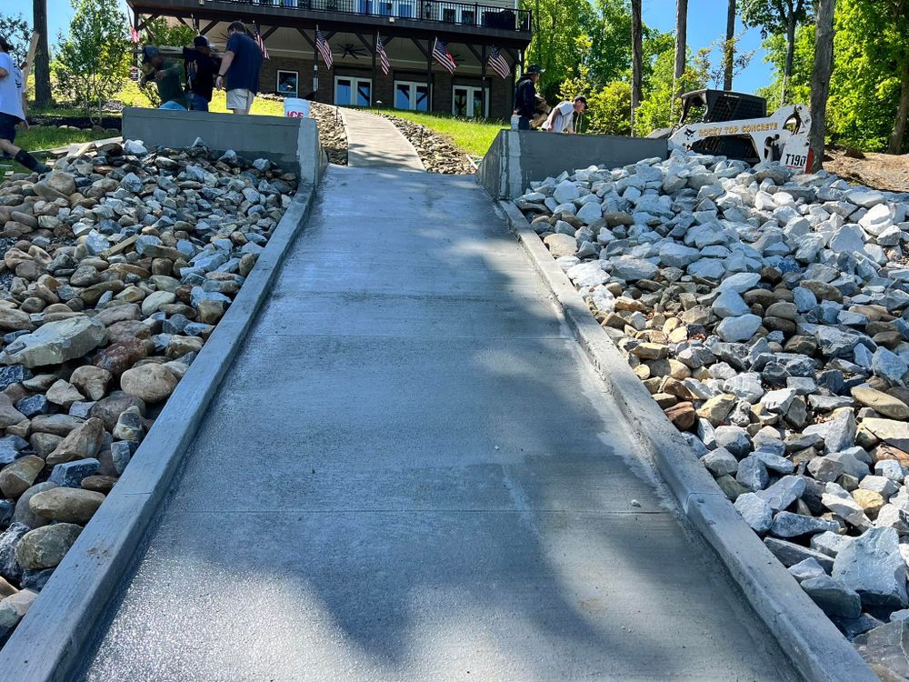Enhance your property's curb appeal with our expert Sidewalk Installation service, providing durable and aesthetically pleasing concrete pathways that ensure safety and elegance while complementing your home's exterior design. for Rocky Top Concrete & Excavating in Knoxville, TN