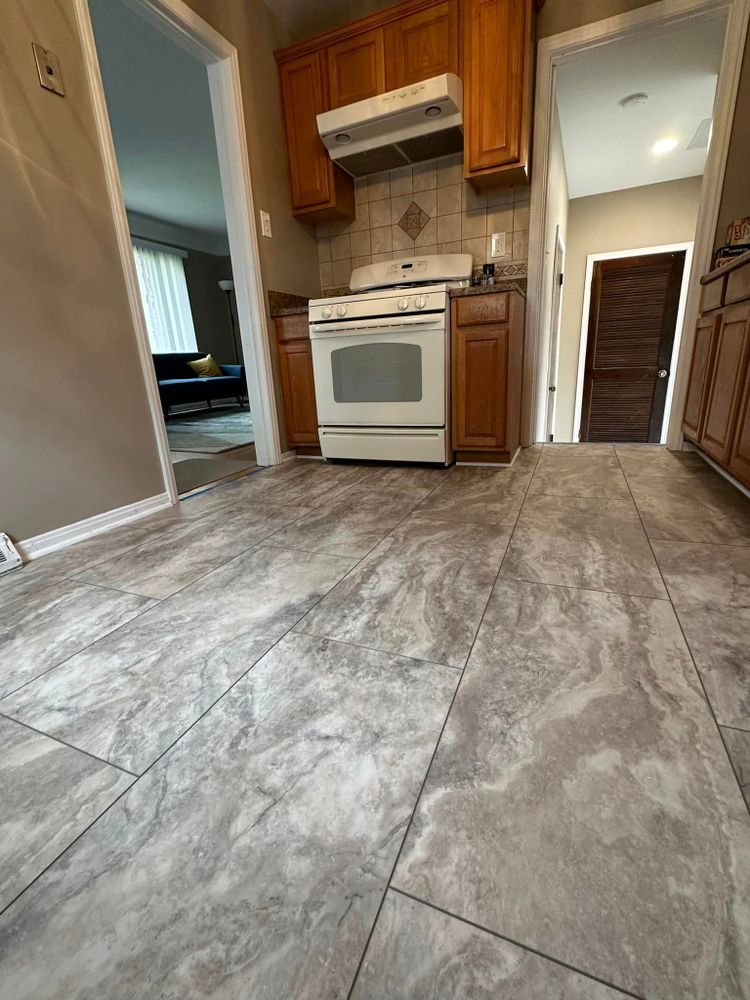 Our vinyl flooring services offer homeowners a durable and affordable option for upgrading their floors. Choose from a wide range of styles and designs to enhance the look of your home. for Reyna’s Flooring & Trim Carpentry  in Allen PArk, MI