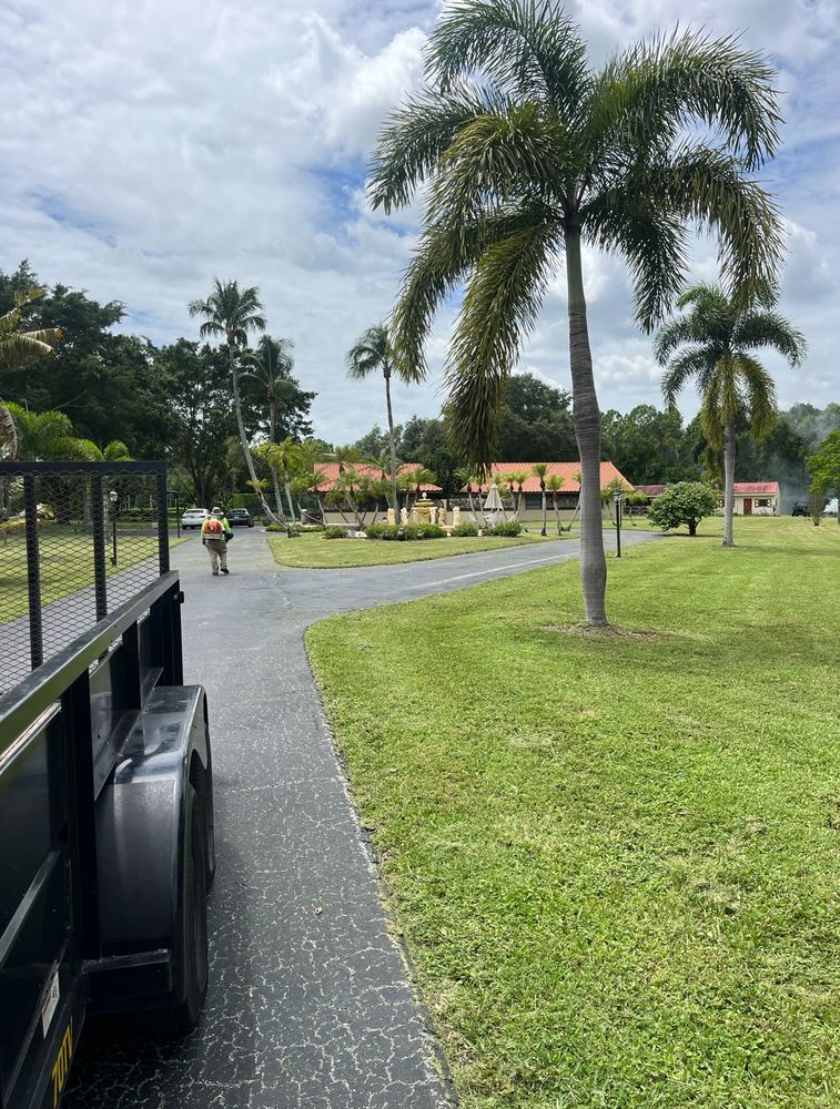 "Our professional mowing service ensures your lawn is perfectly maintained, providing a tidy and well-manicured appearance for your home's exterior. for Green Earth Landscaping & Lawn Care in West Palm Beach,  FL