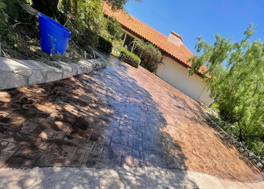 Our Sidewalks service offers professionally designed and installed pathways that enhance the beauty of your outdoor space, providing a safe and convenient walkway for you and your guests. for Oasis Landscaping LLC  in El Paso, TX