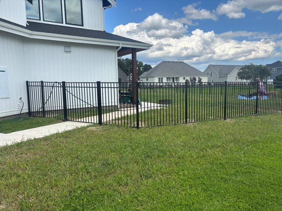 Enhance your property's security and aesthetic with our professional fence installation service, offering customized solutions, quality materials, and expert craftsmanship to ensure durability and satisfaction for every homeowner. for RedLine Fencing in Moyock, NC