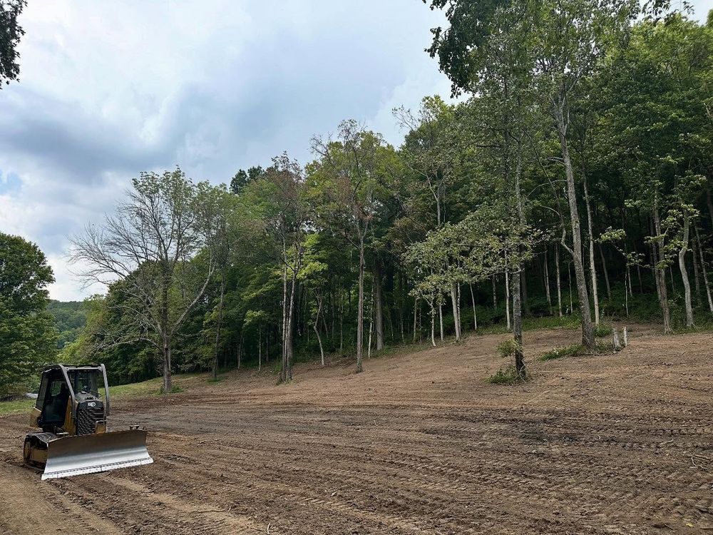Our Land Clearing service efficiently removes trees and debris to prepare your property for construction or landscaping projects while ensuring minimal environmental impact and promoting a safe and clean site for development. for Oaks Excavating in Lyles, TN