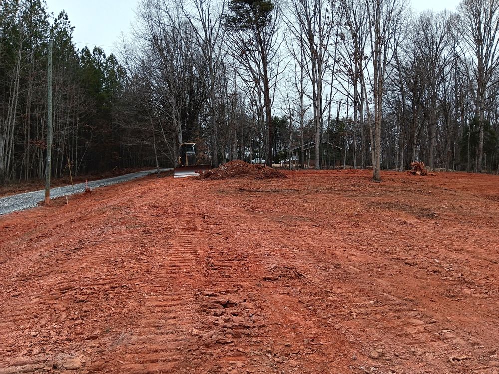 Our Site Preparation service ensures your project starts on solid ground, offering precise grading, land clearing, and drainage solutions for a stable foundation tailored to meet residential construction needs efficiently and professionally. for Baldwin Grading of NC in Pilot Mountain, NC