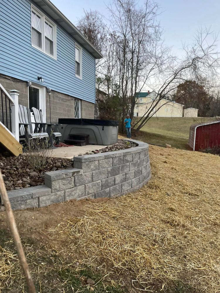 Enhance your outdoor space with our expert retaining wall construction service, providing durability and aesthetic appeal while effectively managing soil erosion, adding value and functionality to your landscape. for Kehl Lawn and Landscape in Athens, OH