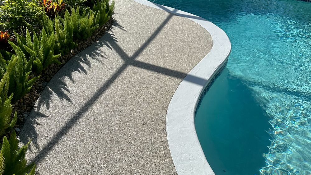 Enhance your pool area with our Resin Rock Decks, providing a durable, slip-resistant surface that combines style and functionality for a safer, more attractive outdoor space around your pool. for Gladiator Construction in St. George, UT