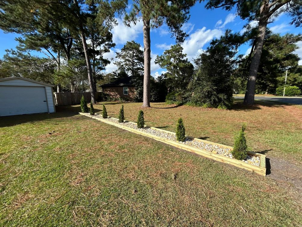 Transform your outdoor space with our expert landscape design service, tailored to enhance beauty and functionality through innovative planning, sustainable practices, and personalized solutions for a stunning garden oasis. for Top Notch Landscape in Sneads Ferry, NC