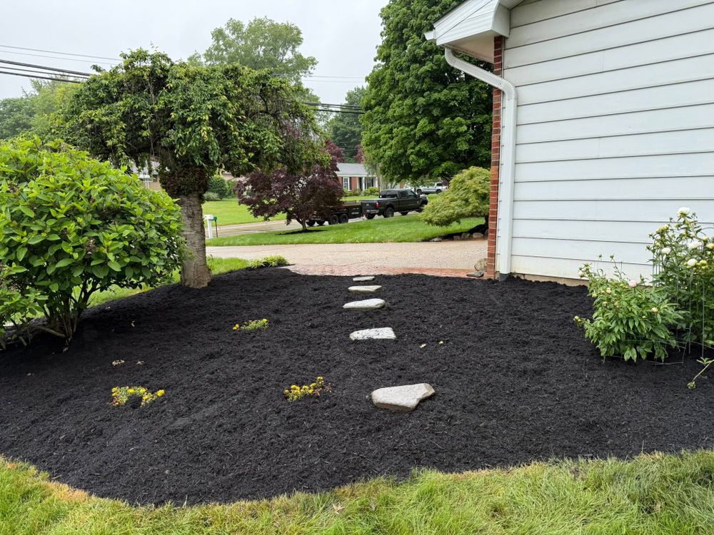 Our Mulch Installation service enhances your landscape's beauty and health, offering expert application of high-quality mulch to retain moisture, suppress weeds, and enrich soil for a vibrant outdoor environment. for Next Level Outdoor Services in Akron, OH