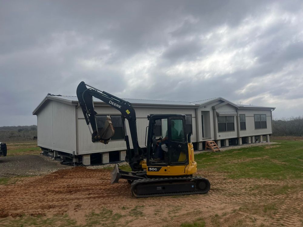 Our House Pad Construction service ensures a stable, leveled foundation for your home, expertly crafted with precision and quality materials, setting the stage for safe and secure future construction projects. for Williams & Sons Solutions in Floresville, TX