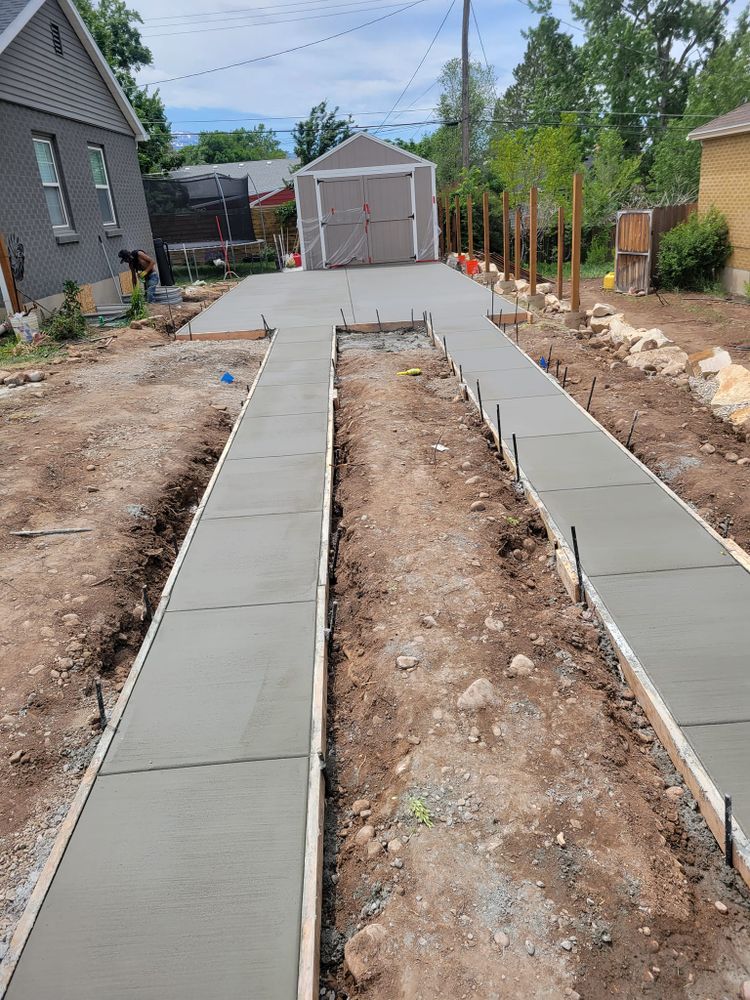 Transform your outdoor space with our expert Sidewalk Installation service. Our team ensures durable, attractive sidewalks that enhance curb appeal and functionality, tailored to complement your home's unique style and needs. for Artisan Concrete in Bluffdale, UT