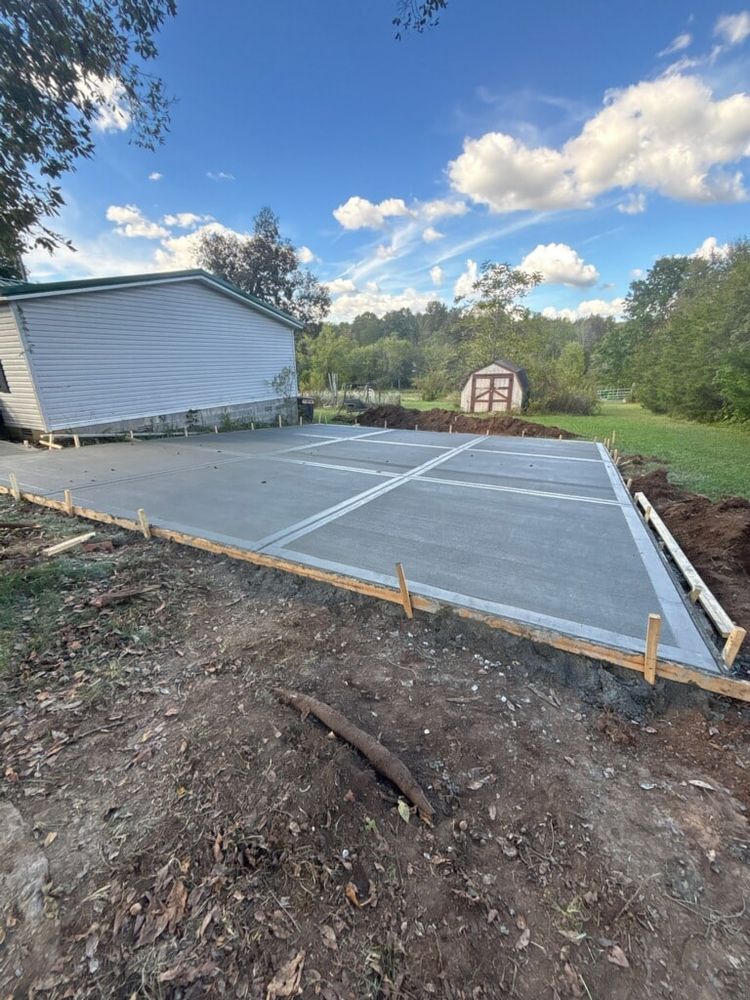Our Concrete Slab Construction service provides durable, precisely engineered foundations tailored to your home's specific needs, ensuring stability and longevity for any structure while enhancing overall property value. for Yates Construction & Excavation in Arrington, Tennessee