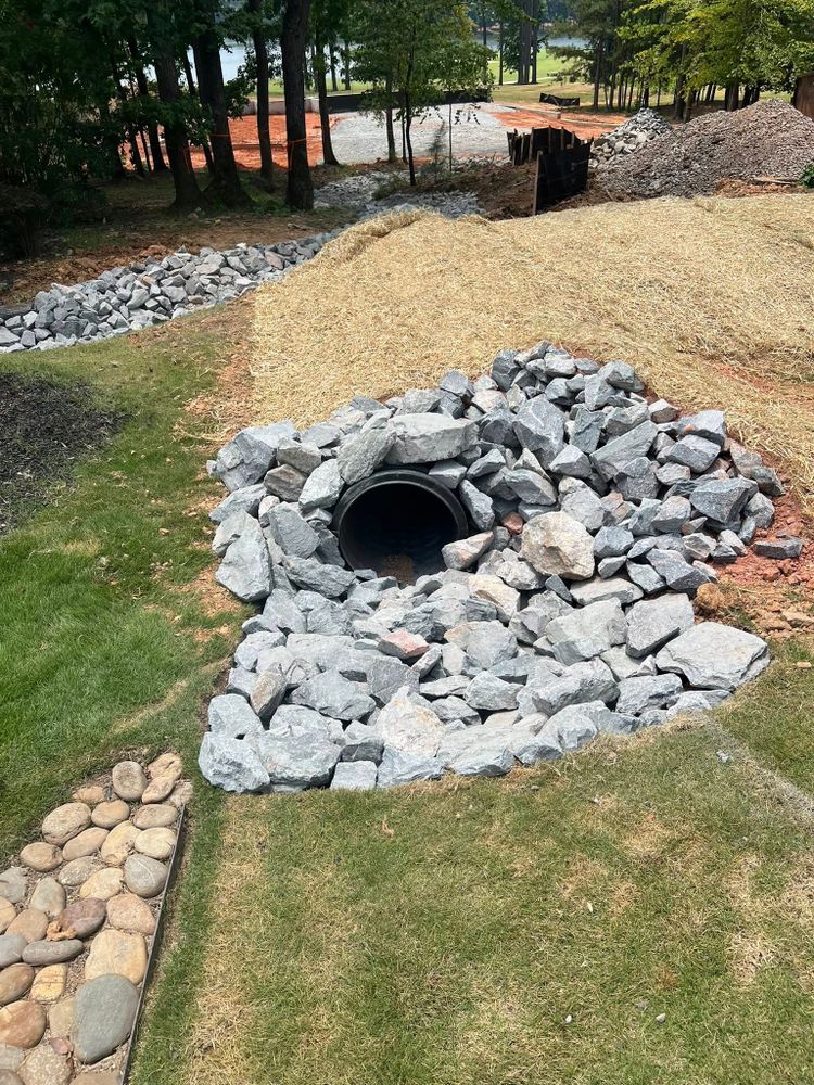 Our French Drain Install service expertly redirects water away from your home's foundation, preventing flooding and water damage by efficiently channeling excess moisture through a reliable underground drainage system. for Clarks Hill Property Solutions in McCormick, SC