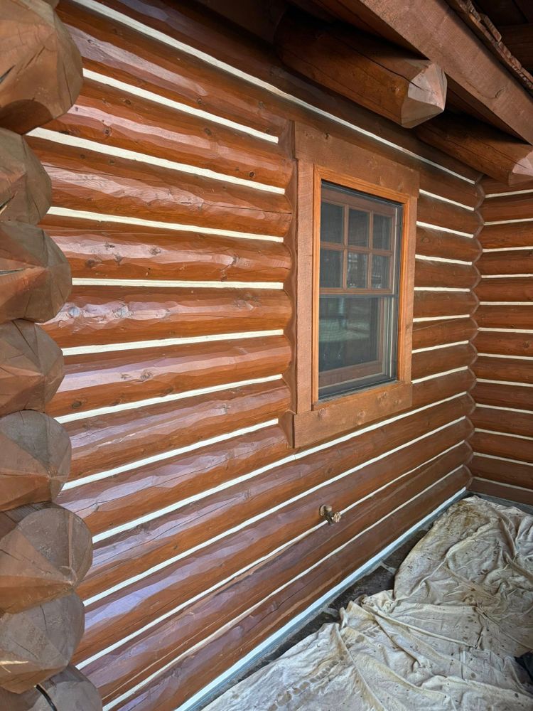 Our Log Home Restoration service revitalizes your home by repairing, cleaning, and resealing logs to enhance beauty and prevent damage, ensuring longevity while maintaining the natural charm of your log home. for Wild West Log home specialists in Corvallis, MT