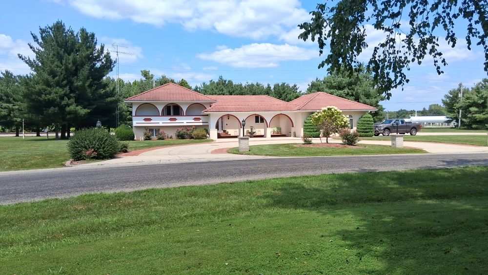 Our House Wash service gently cleans exterior surfaces using eco-friendly solutions, removing dirt, mold, and grime to restore your home's beauty and protect its value without damaging delicate areas. for Haskett Pro-Wash in Newton, IL