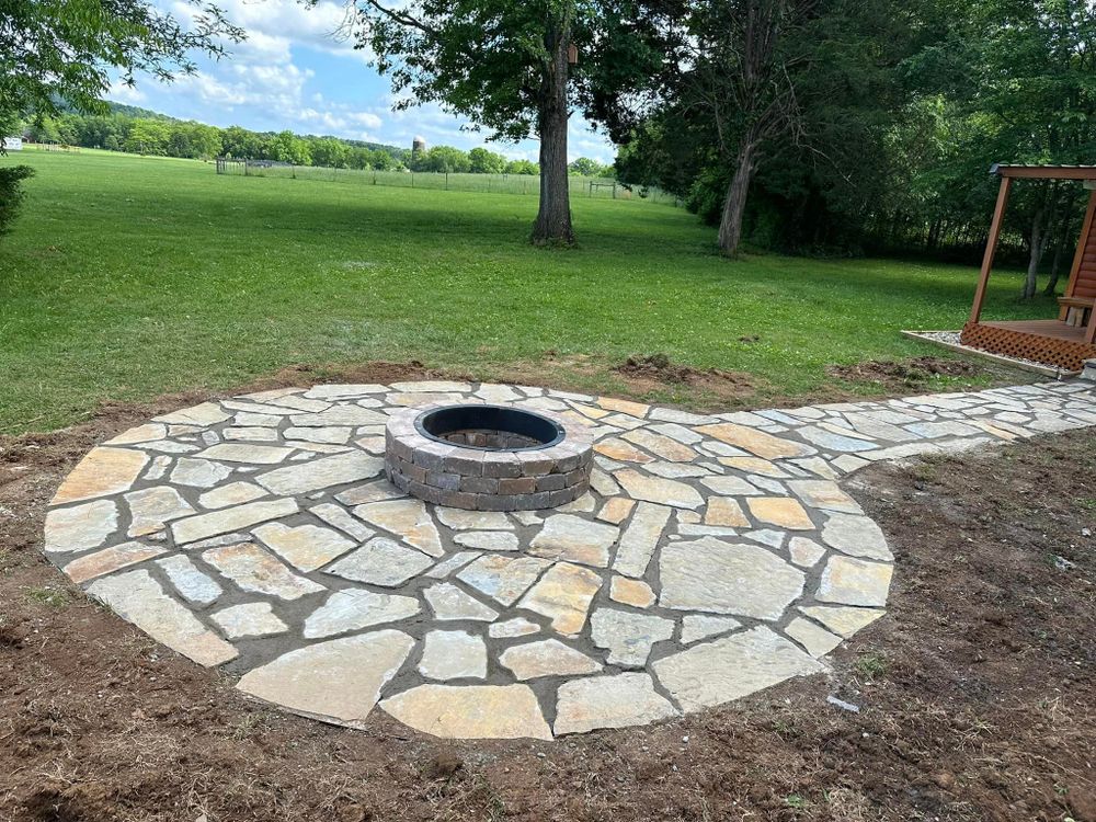 Our Hardscaping service can transform your outdoor space with durable and visually appealing features such as patios, walkways, retaining walls, and fire pits that enhance the beauty and functionality of your property. for Mike Feagin Construction in Lewisburg, TN