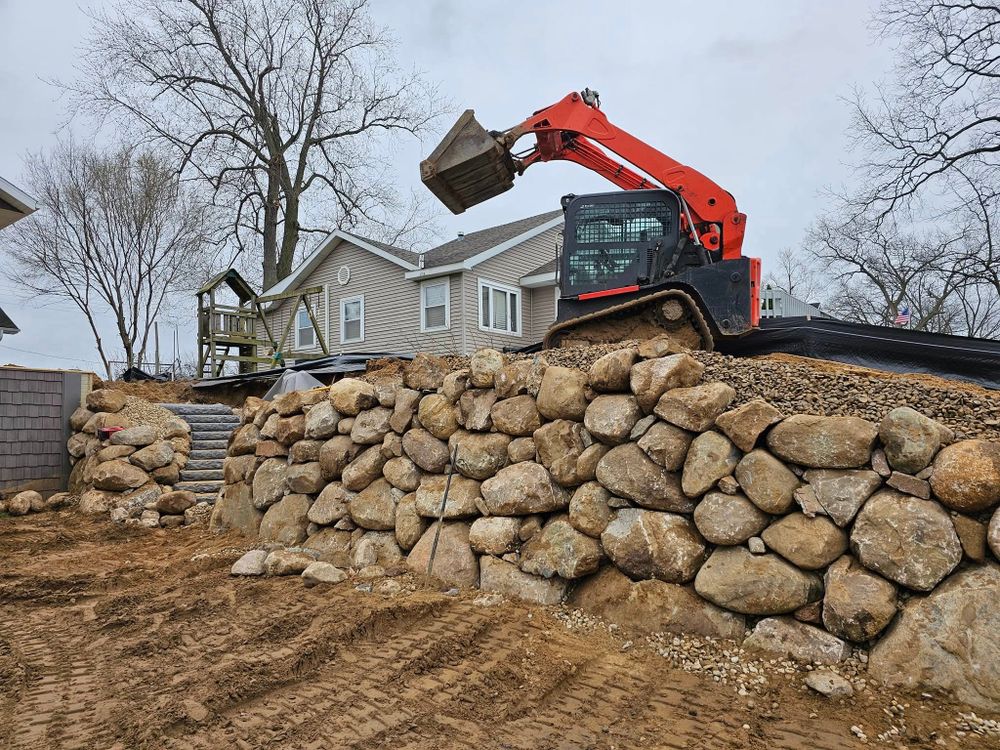 Discover the true excavation meaning with our expert excavating services, designed to transform your outdoor spaces by creating precise groundwork for landscaping projects, ensuring a solid foundation for breathtaking results. for Michiana Boulders Landscaping & Excavating in Union, MI