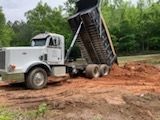 Our Hauling service offers efficient and reliable transportation of debris, trees, and other materials during our land clearing projects to ensure a smooth experience for homeowners. for Triple P Excavation in Atlanta, GA