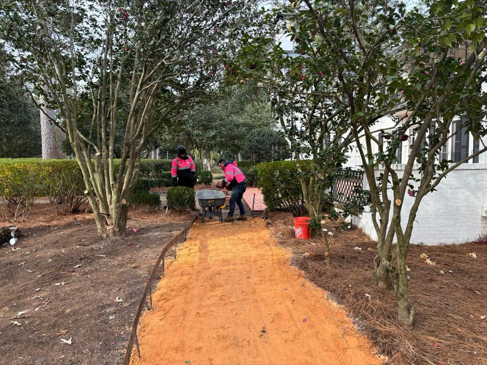 Our Pavers & Walkways service offers homeowners the opportunity to enhance their outdoor spaces with professionally designed and installed pathways, creating a visually appealing and functional environment. for Pink Pelican Tree Service & Landscaping in Columbia, SC