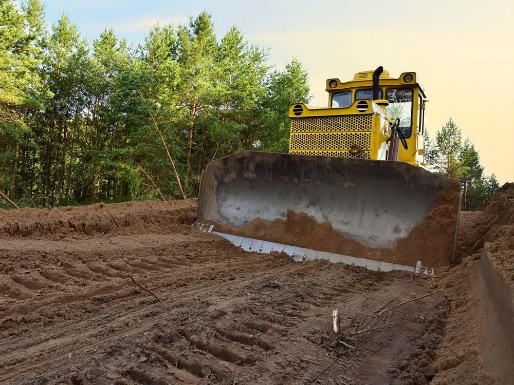 Transform your property with our land grading service. We ensure a level foundation, improved drainage, and enhanced landscape aesthetics, making your outdoor spaces safer and more beautiful for future projects. for Walley Construction LLC  in Hubbard, OH