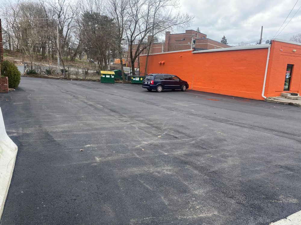 Our Commercial Asphalt Services provide durable, long-lasting solutions for your property's driveways and parking lots, ensuring smooth surfaces that enhance curb appeal and withstand heavy use, while prioritizing quality craftsmanship and customer satisfaction. for Aldrich & Sons Asphalt Services in Lowell, MA