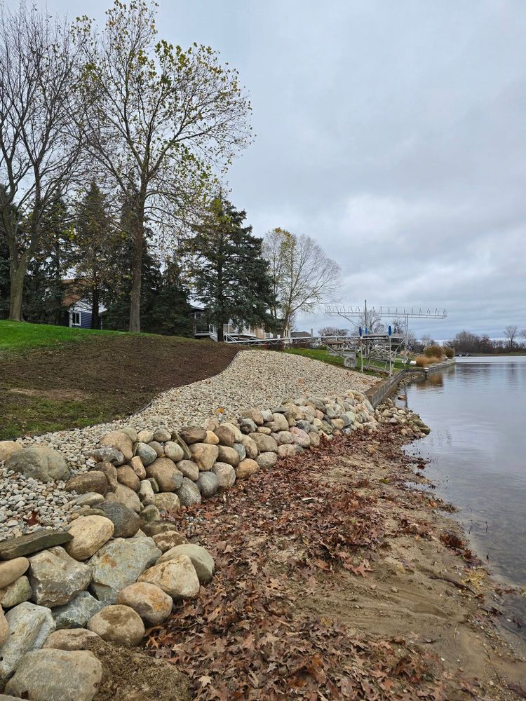 Enhance your property's shoreline with our expert seawall construction, providing durable protection against erosion while adding aesthetic value and stability to your landscape. Trust us for reliable, tailored solutions that last. for Michiana Boulders Landscaping & Excavating in Union, MI