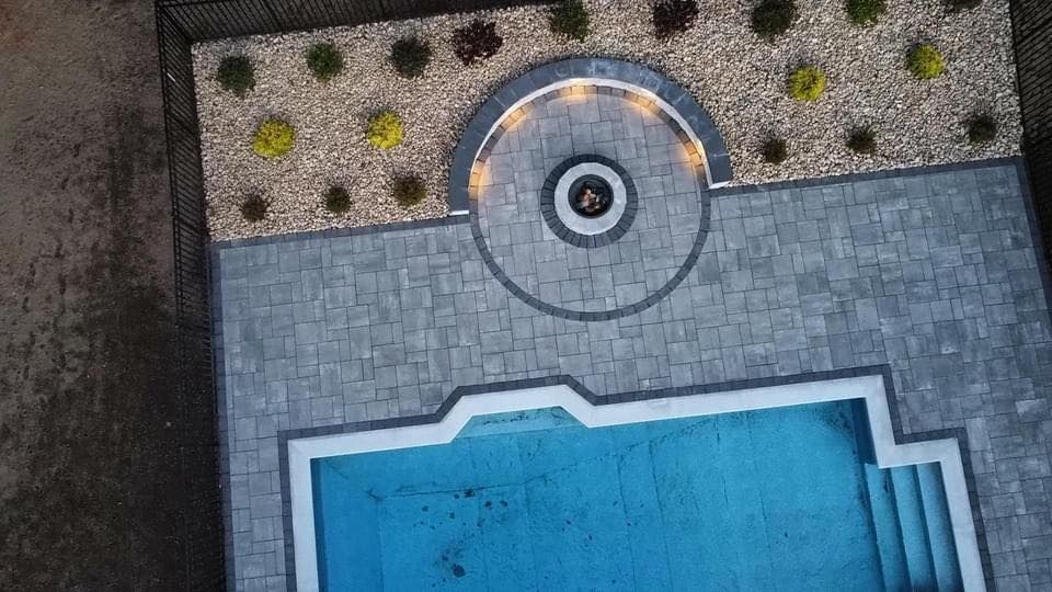 Enhance your outdoor oasis with our professional Pool Deck Paving service, delivering durable and stylish surfaces that combine functionality and aesthetics for a safe, slip-resistant area perfect for relaxation and entertainment. for Shawn's Landscaping in Mendon, MA