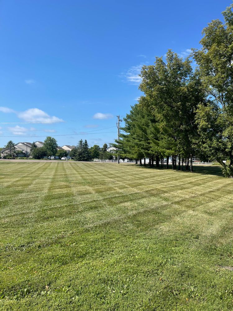 Our mowing service ensures a neatly trimmed lawn, enhancing your home's curb appeal. With precision cuts and reliable scheduling, we maintain the health and appearance of your grass all season long. for Bubba’s Seasonal Services in Buffalo, MN