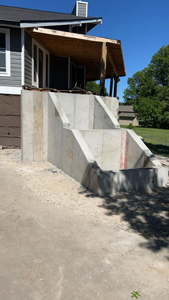 Our Stair Design & Installation service offers homeowners the opportunity to enhance their property with durable and stylish concrete stairs, expertly crafted to elevate aesthetic appeal and improve functionality in any space. for Travis Hill Concrete & Construction in Topeka, KS