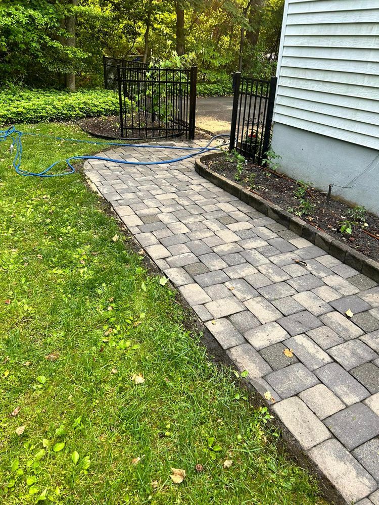 Our Driveway and Sidewalk Cleaning service utilizes high-pressure washing to effectively remove dirt, grime, and mold buildup, restoring surfaces to their original condition for enhanced curb appeal and safety. for Nuflo Gutter Cleaning & Pressure Washing in Blackwood, NJ