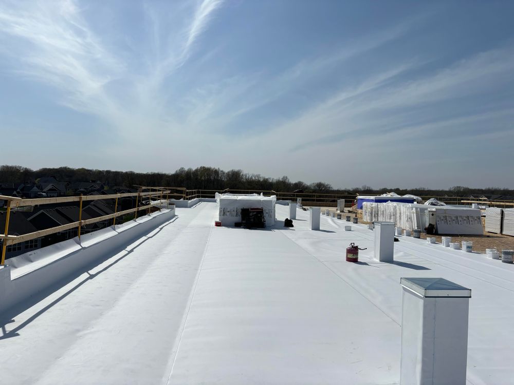 Our TPO roofing service offers durable and cost-effective solutions for your commercial property, ensuring long-lasting protection against the elements with expert installation and reliable roofing repairs. for Elmcrest Construction in Harris,  MN