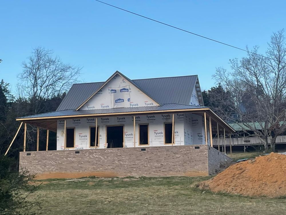 Discover our Custom Home Design service, where we transform your unique vision into reality, ensuring every detail reflects your personal style and meets high-quality standards for a perfectly tailored home experience. for Trace Lawson Construction in Hohenwald, TN