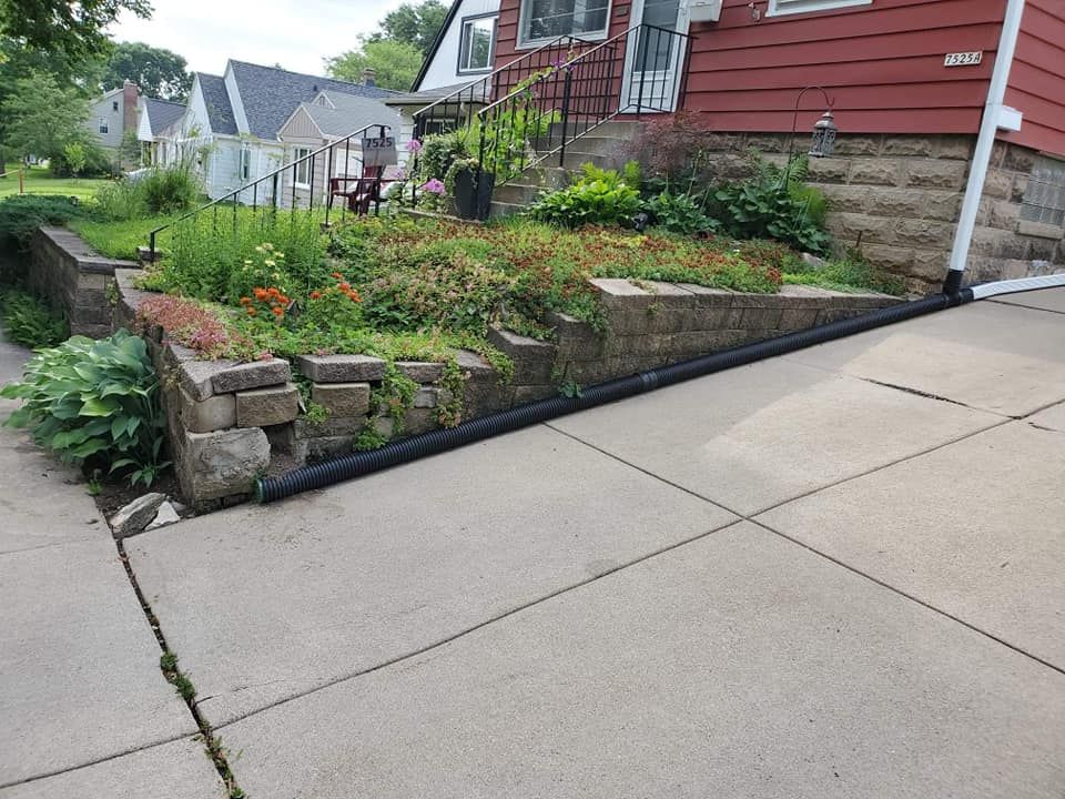 Enhance your property with our professional retaining wall construction service. Our skilled masons will create a sturdy and visually appealing structure to help prevent erosion and improve the overall aesthetics of your landscape. for JM Restoration LLC. in South Milwaukee, WI