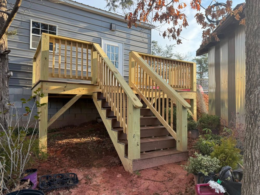 Enhance your outdoor living space with our Custom Deck Building service, offering personalized designs and quality craftsmanship to create the perfect deck tailored to your specific needs and lifestyle. for Karnezis Construction in Candler, NC
