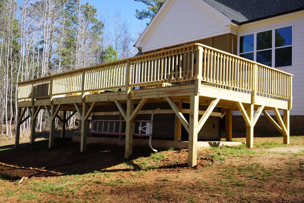 Transform your outdoor space with our expert deck and patio installation services. We blend style and functionality to create stunning, durable areas perfect for relaxation or entertaining guests. for Top Plate Construction in Clayton, NC