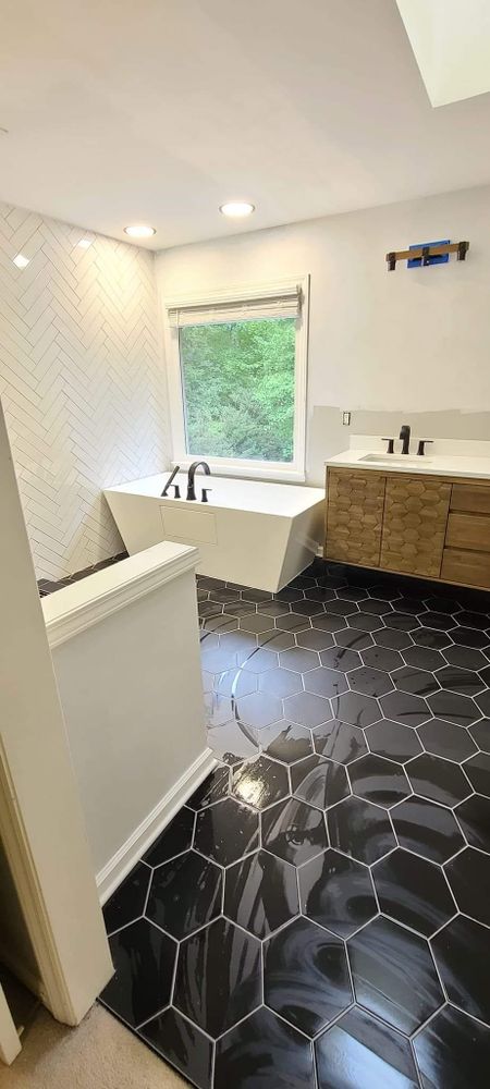 Transform your bathroom into a luxurious retreat with our expert renovation service. From modern upgrades to complete remodels, we bring style and functionality to your space with top-quality materials. for Landin's TILE WORK in Shelby, NC