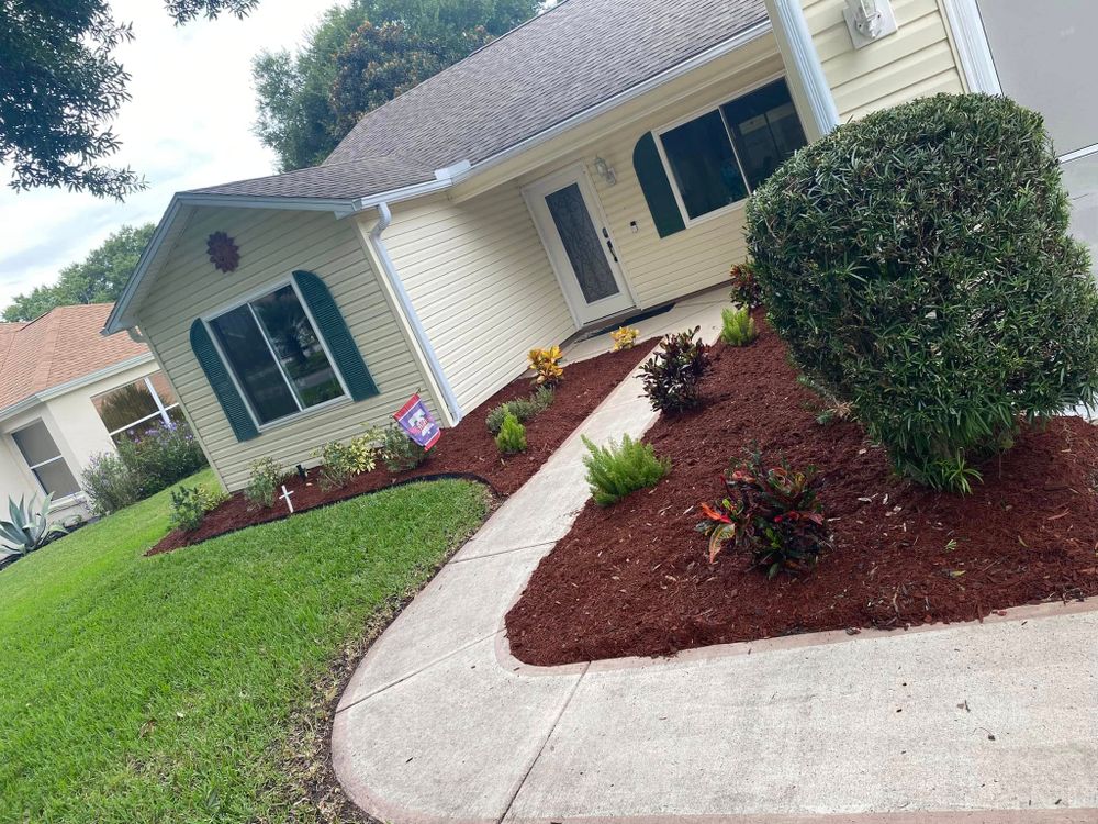 Enhance your garden's health and aesthetics with our professional mulch installation service. We provide expert layering to retain moisture, suppress weeds, and enrich soil for a thriving landscape all year round. for Bob's Mow n GO LLC in Lady Lake, FL