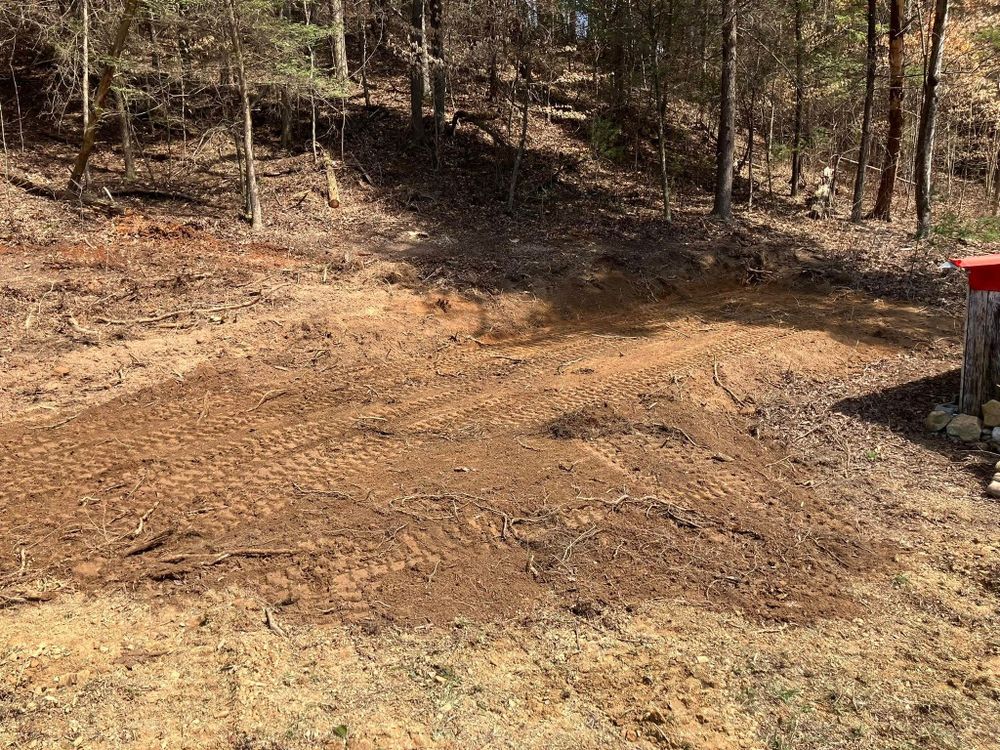 Our Land Grading service ensures a smooth, level surface by expertly reshaping your property terrain, improving drainage and soil stability to prepare for construction or landscaping projects. Perfect groundwork for your home’s future. for Genesis Landworks in Bluff City, TN