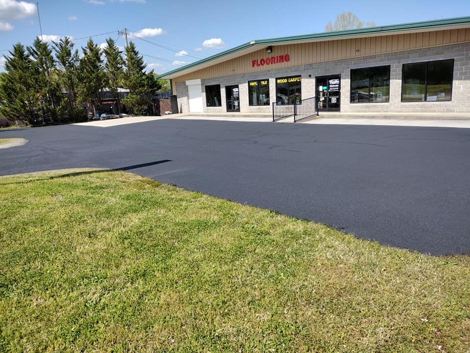Enhance your home's curb appeal with our expert Roadway Paving service, offering durable and smooth asphalt surfaces tailored for durability and aesthetics to meet all residential paving needs effectively. for Stripe A Lot in Knoxville, TN